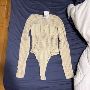 Forever 21 crotchet see through bodysuit. Never worn. New with tags. Size Small